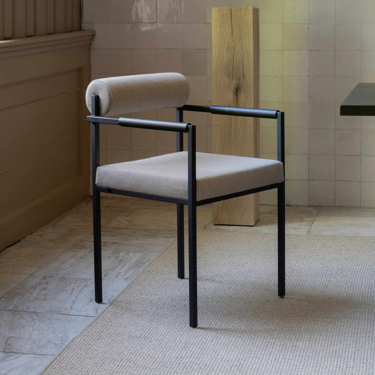 Bolster dining chair with armrest