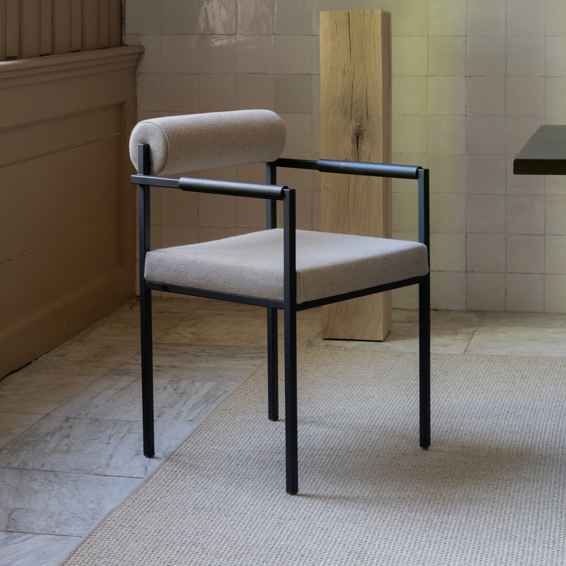 Bolster dining chair with armrest