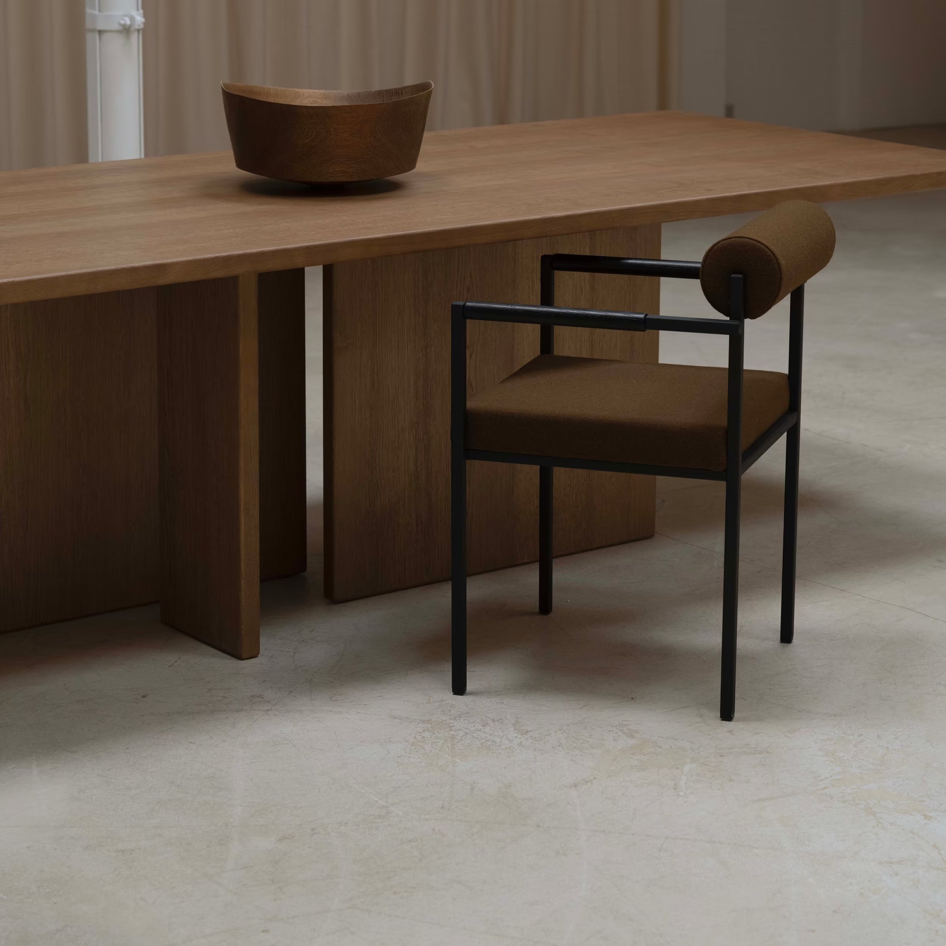 Bolster dining chair with armrest
