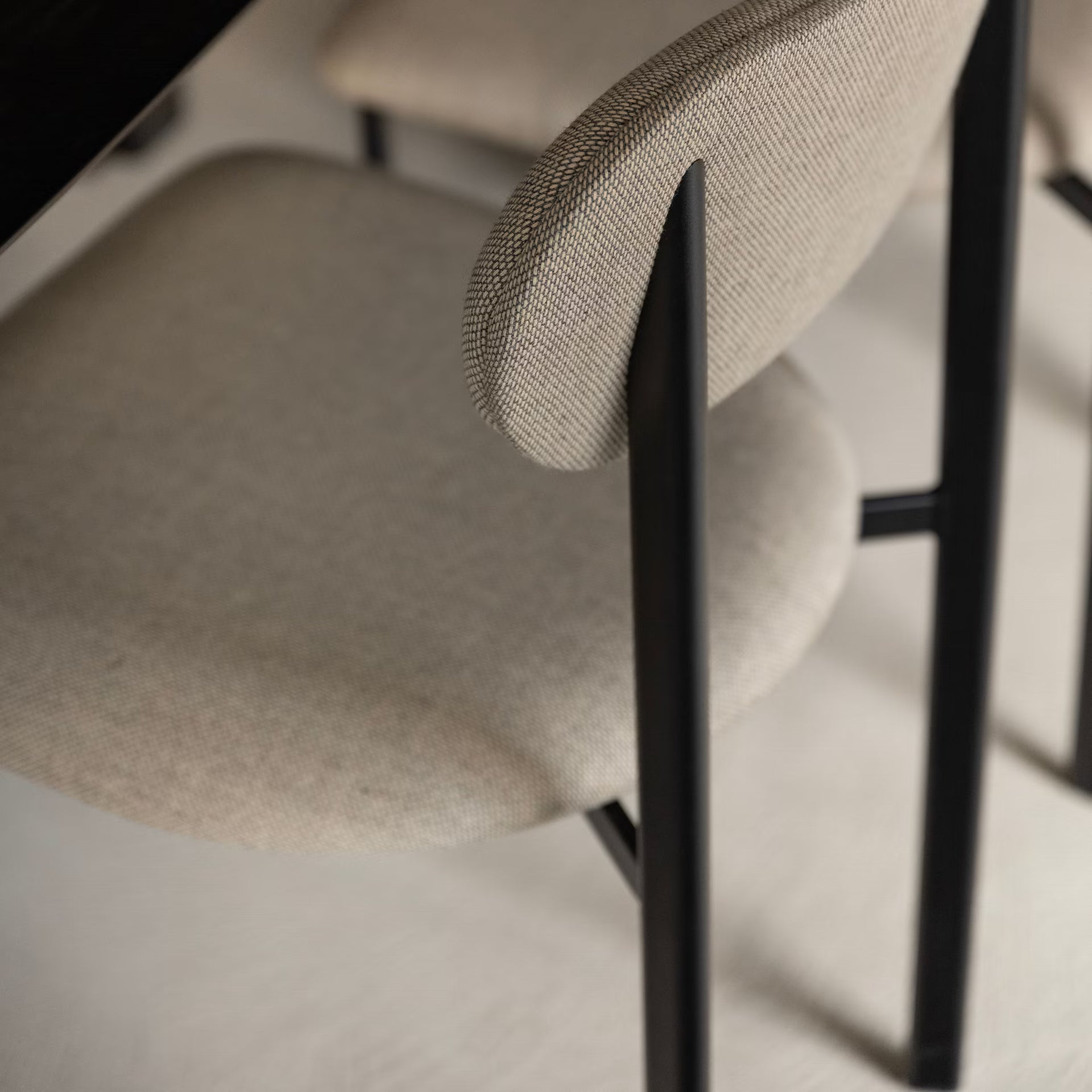 Oblique dining chair with armrest