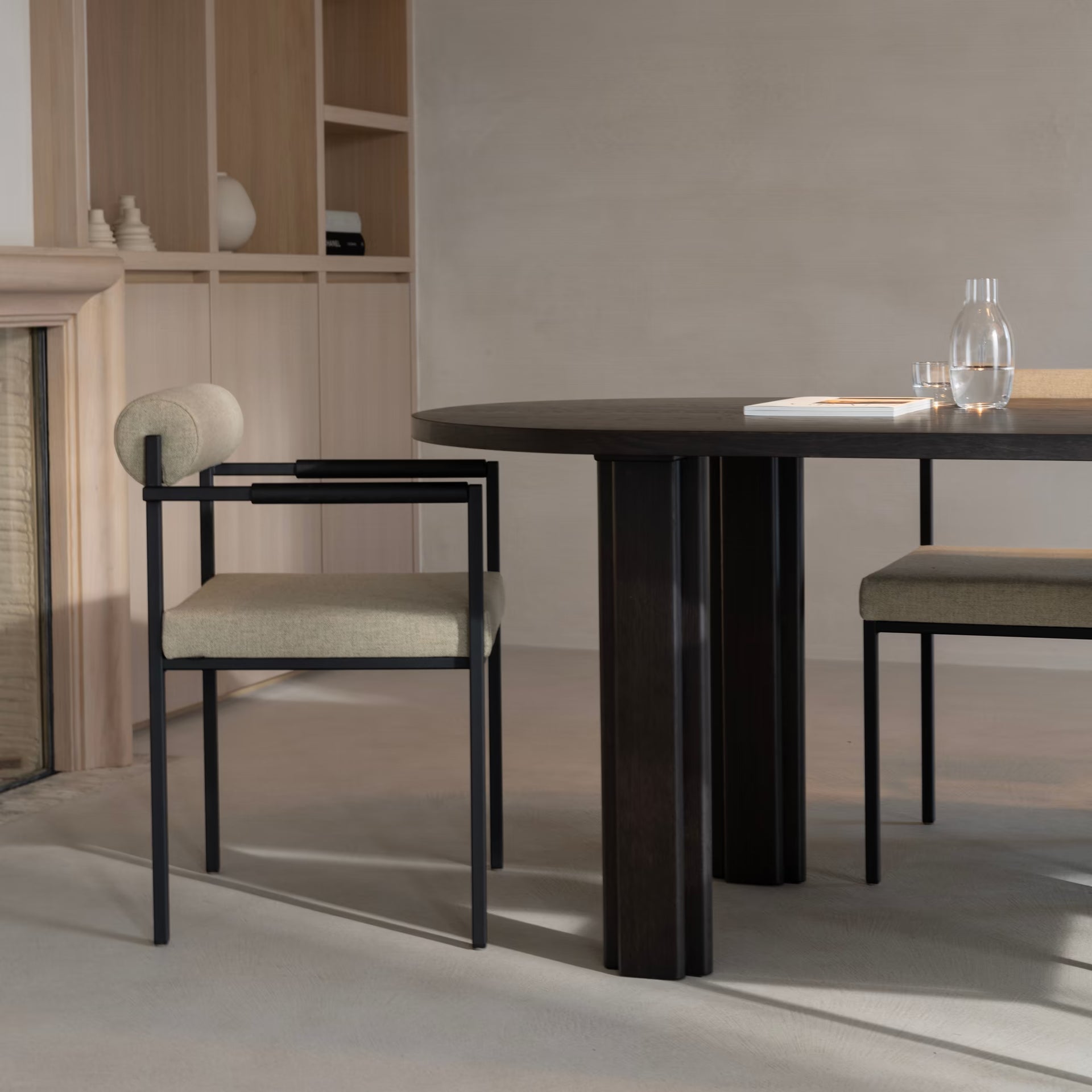 Bolster dining chair with armrest