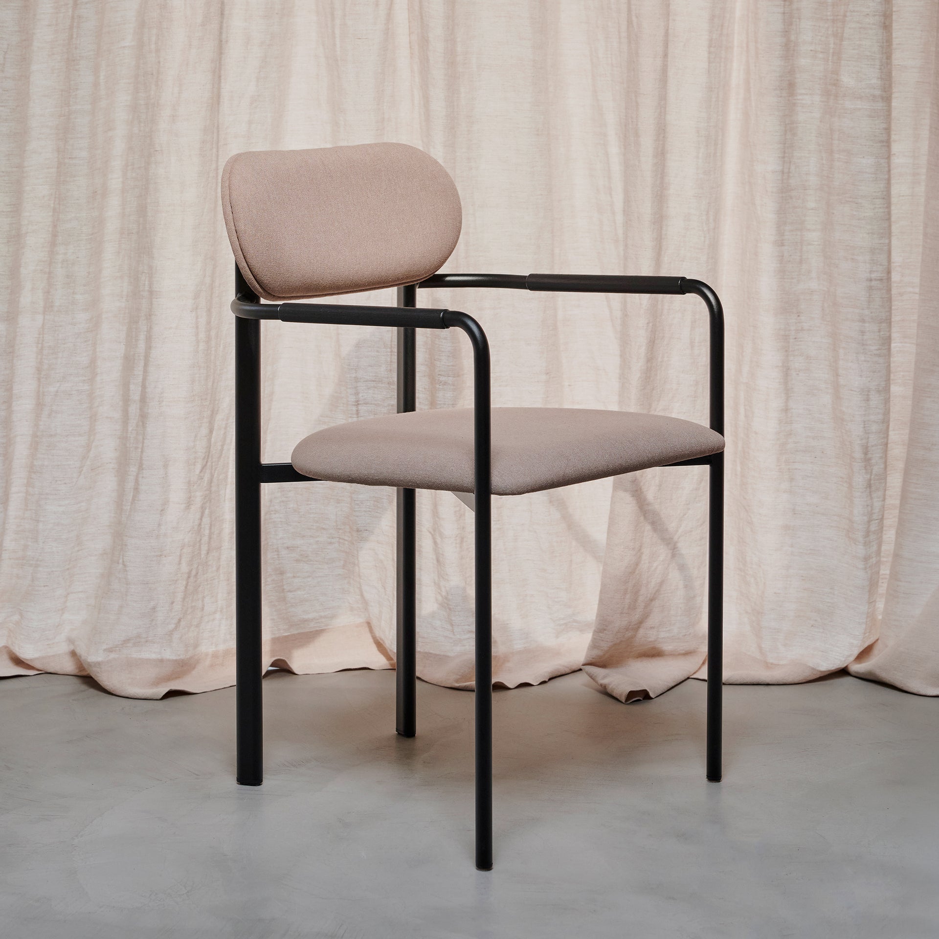 Oblique dining chair upholstered with armrest