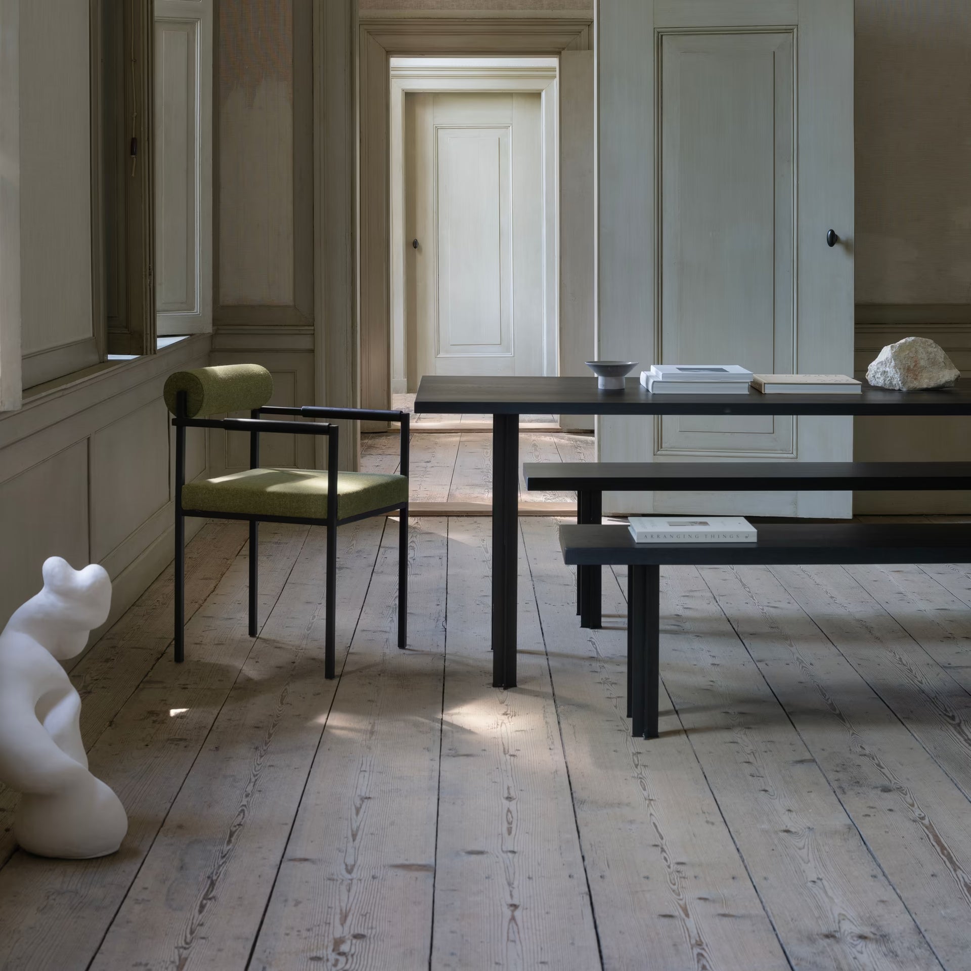 Bolster dining chair with armrest