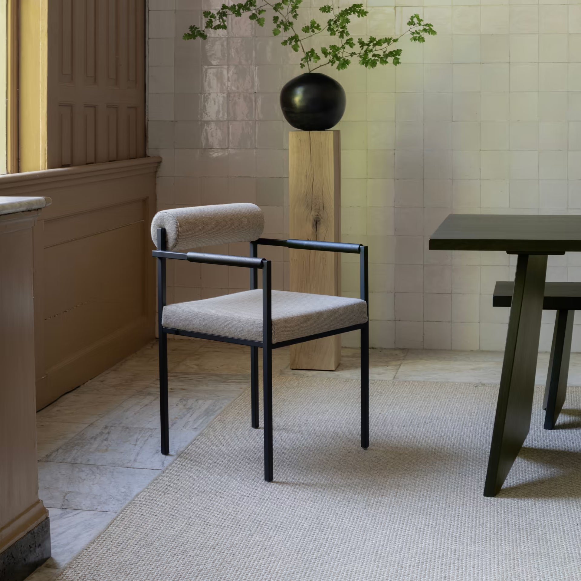 Bolster dining chair with armrest