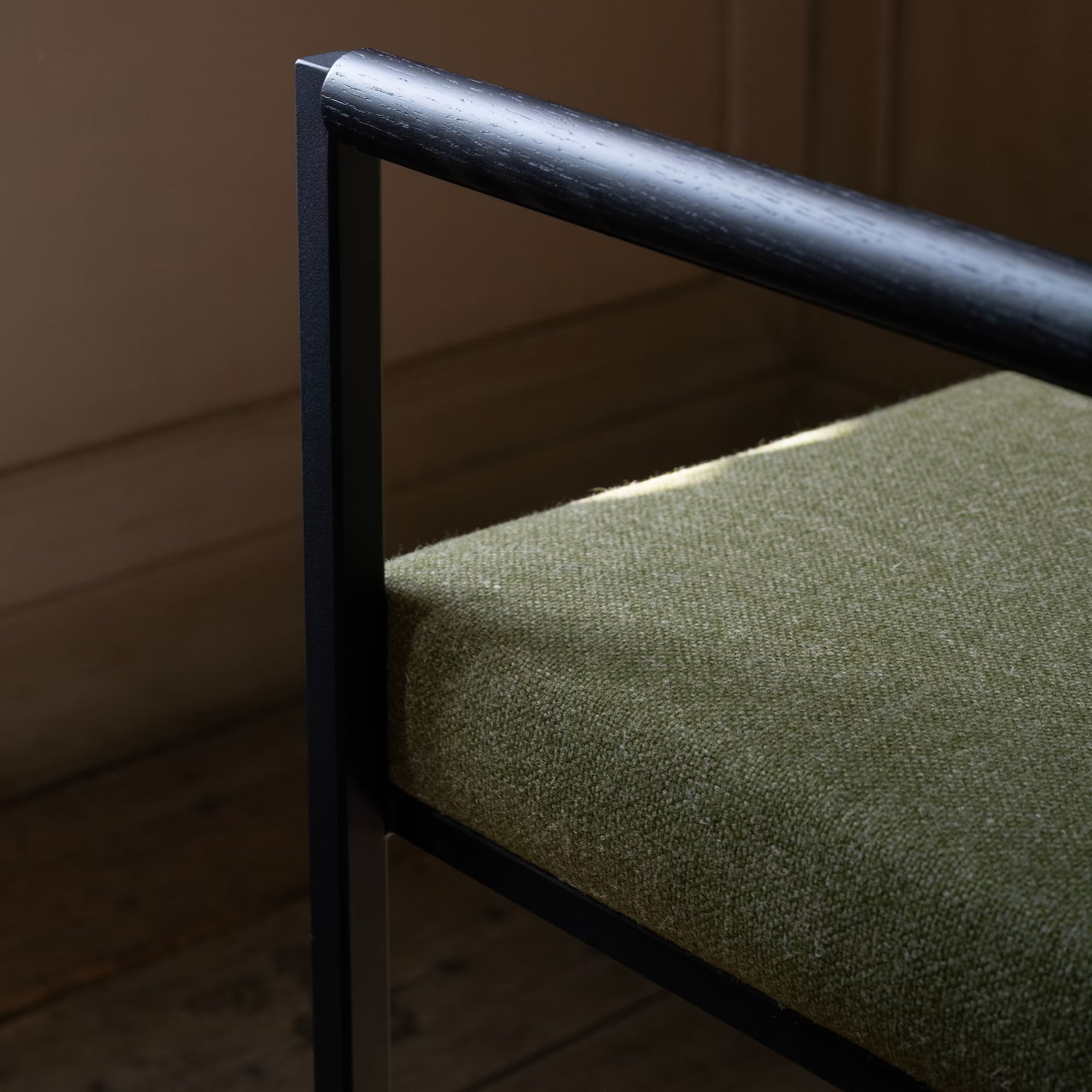Bolster dining chair with armrest